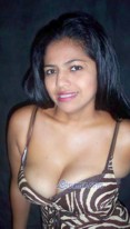 Sexy Latina girl showing ample cleavage